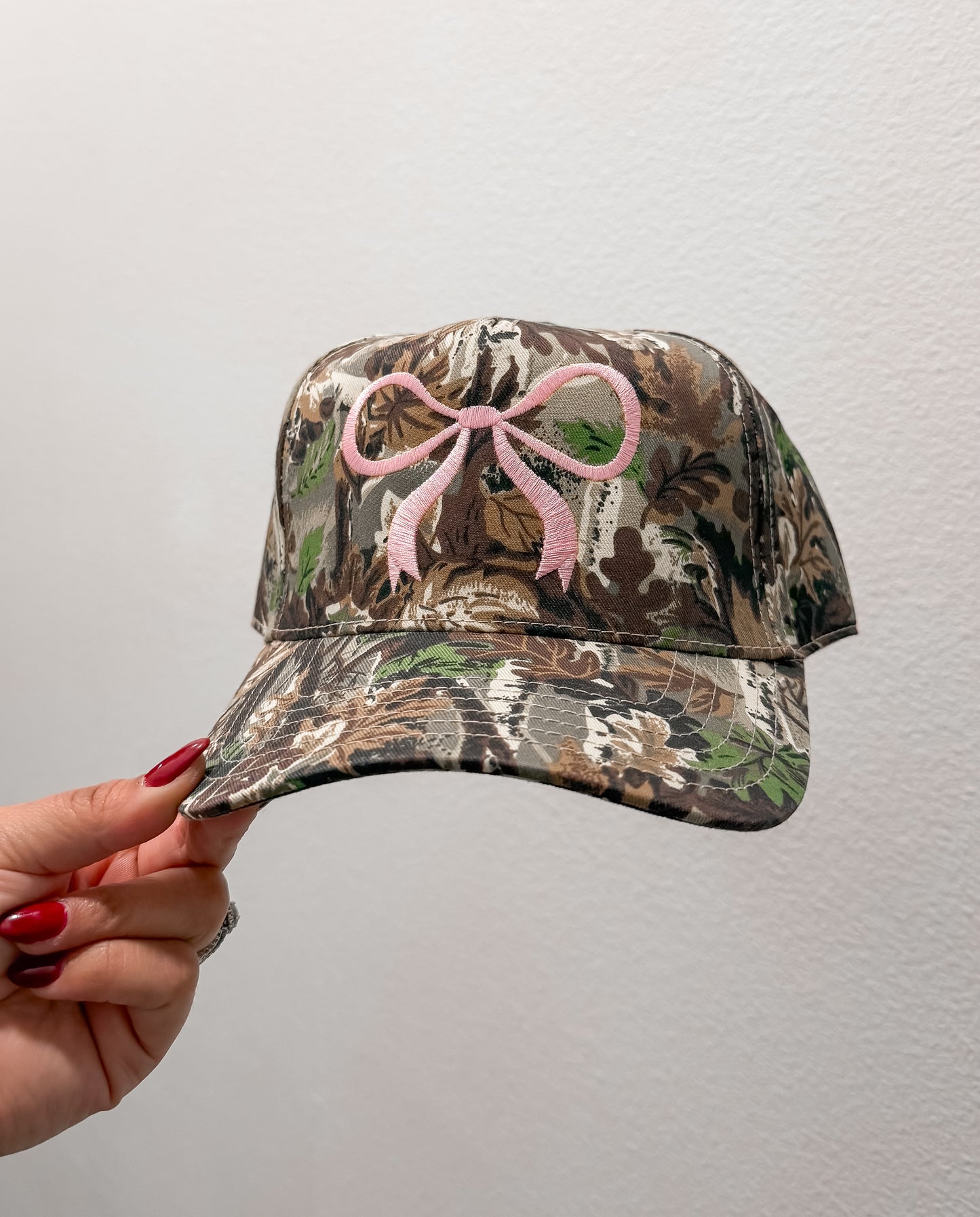 PINK BOW | CAMO TRUCKER HAT
