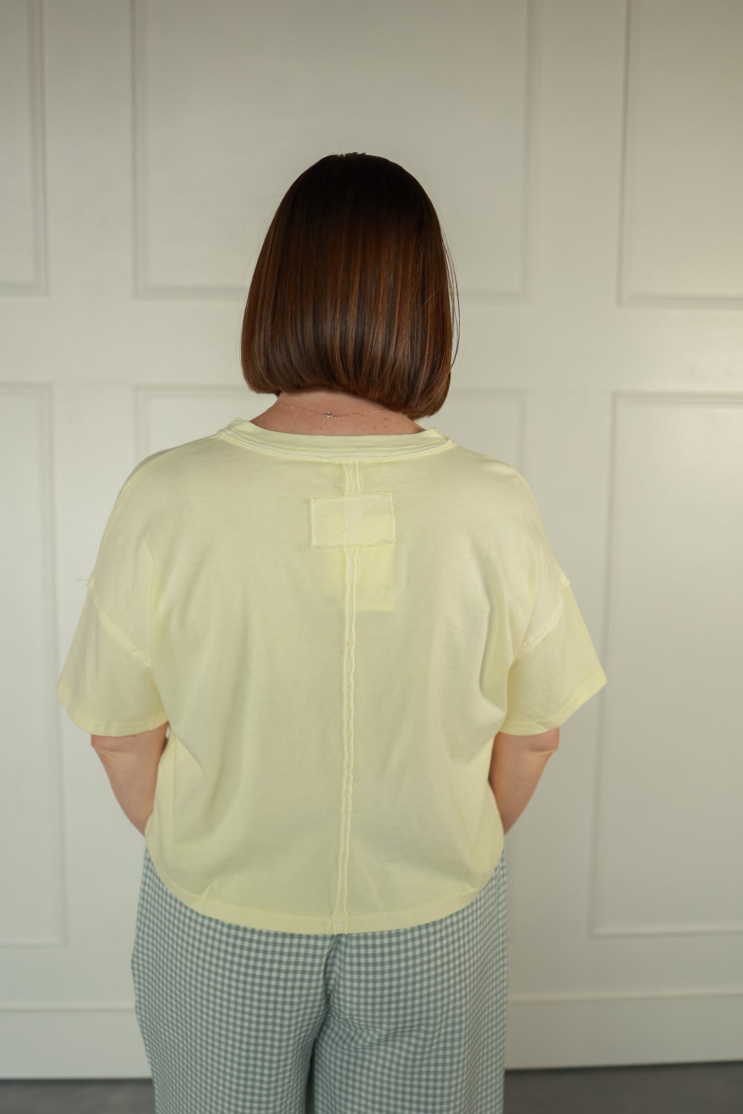 THE YELLOW TEE WITH BUTTONS