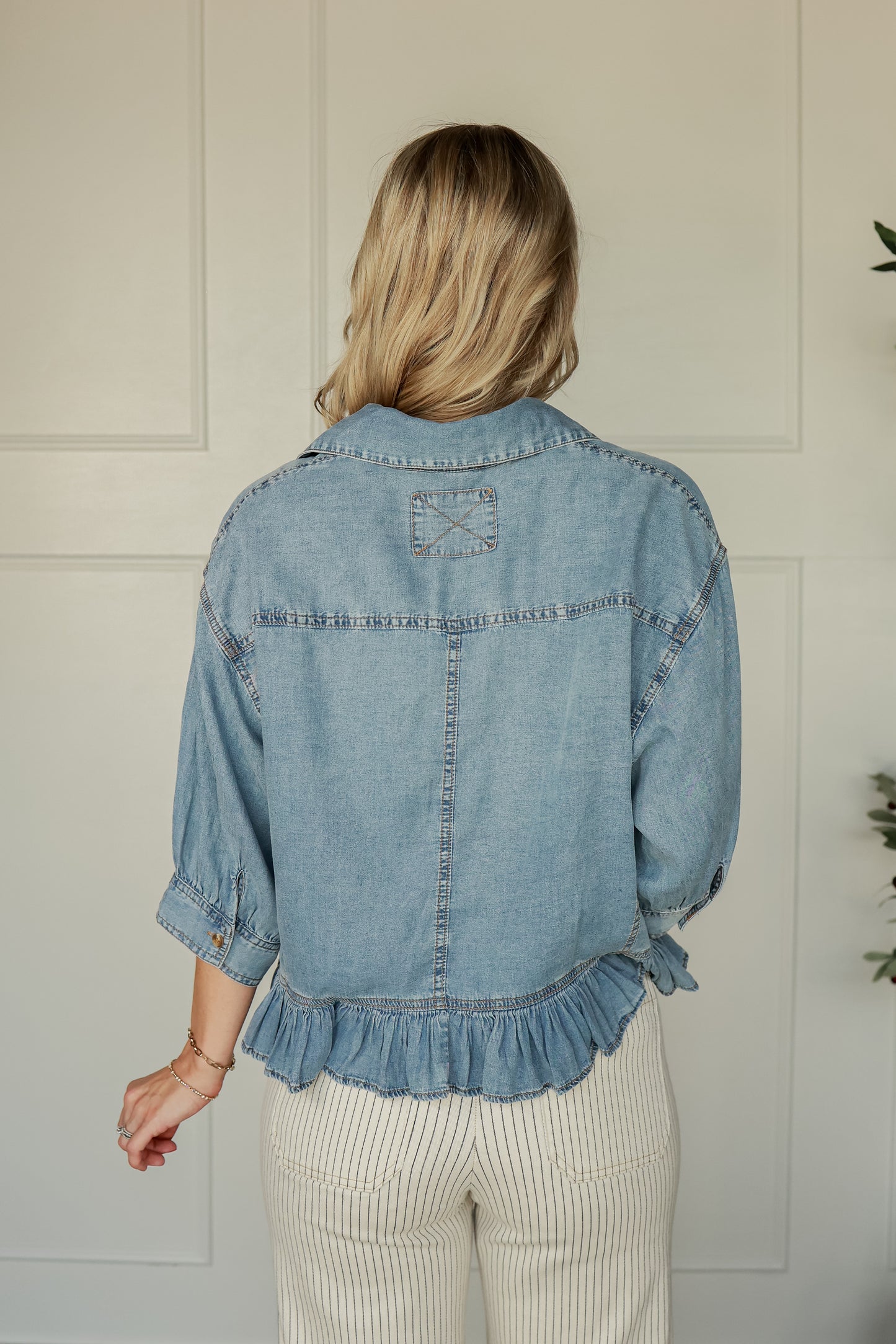 THE RUFFLE HEM DENIM TOP