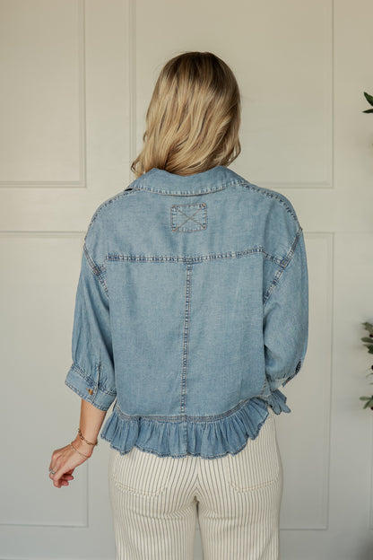 THE RUFFLE HEM DENIM TOP