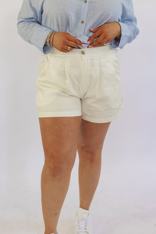 AN ELEVATED PLEATED SHORT IN WHITE
