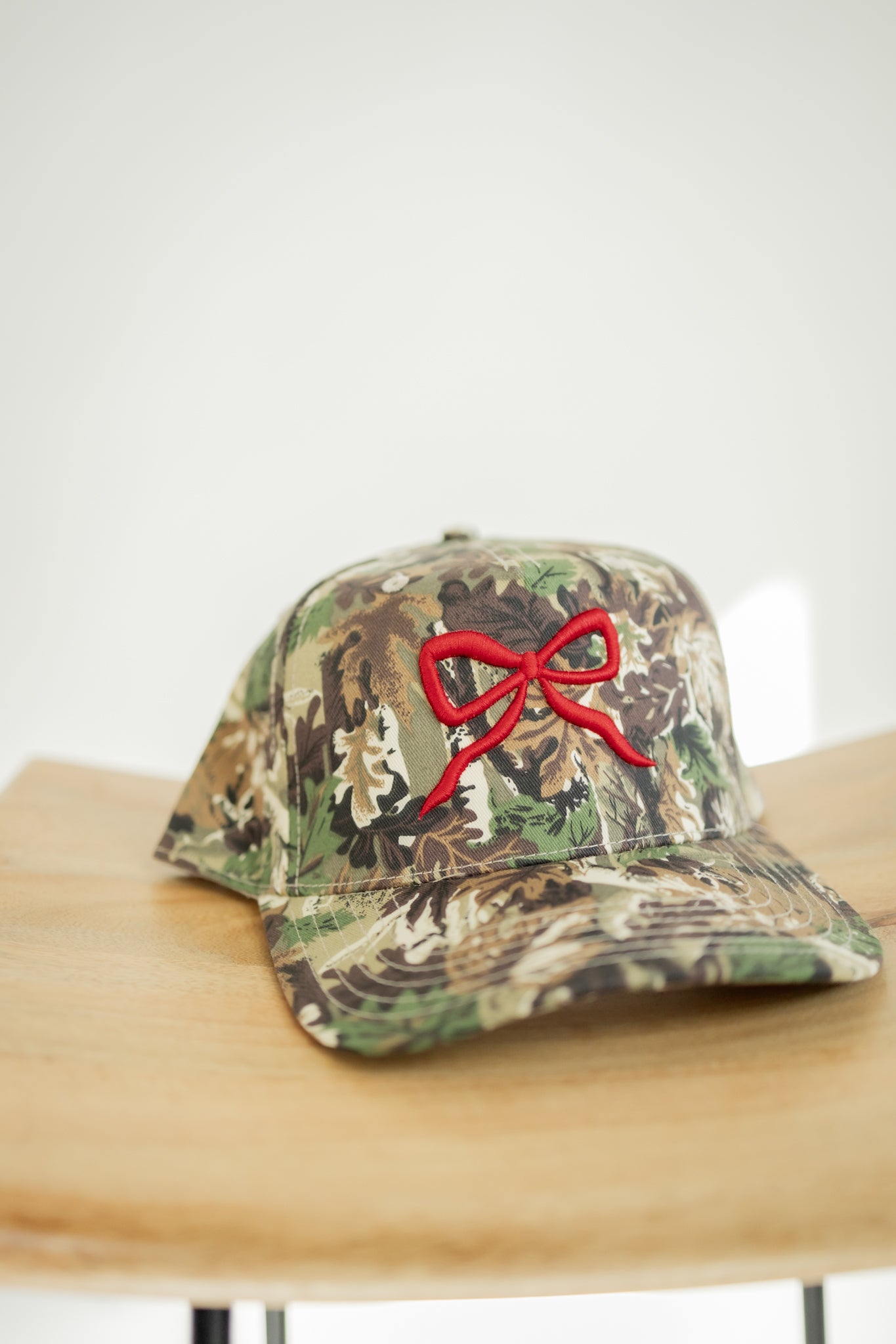 RED BOW | CAMO TRUCKER HAT