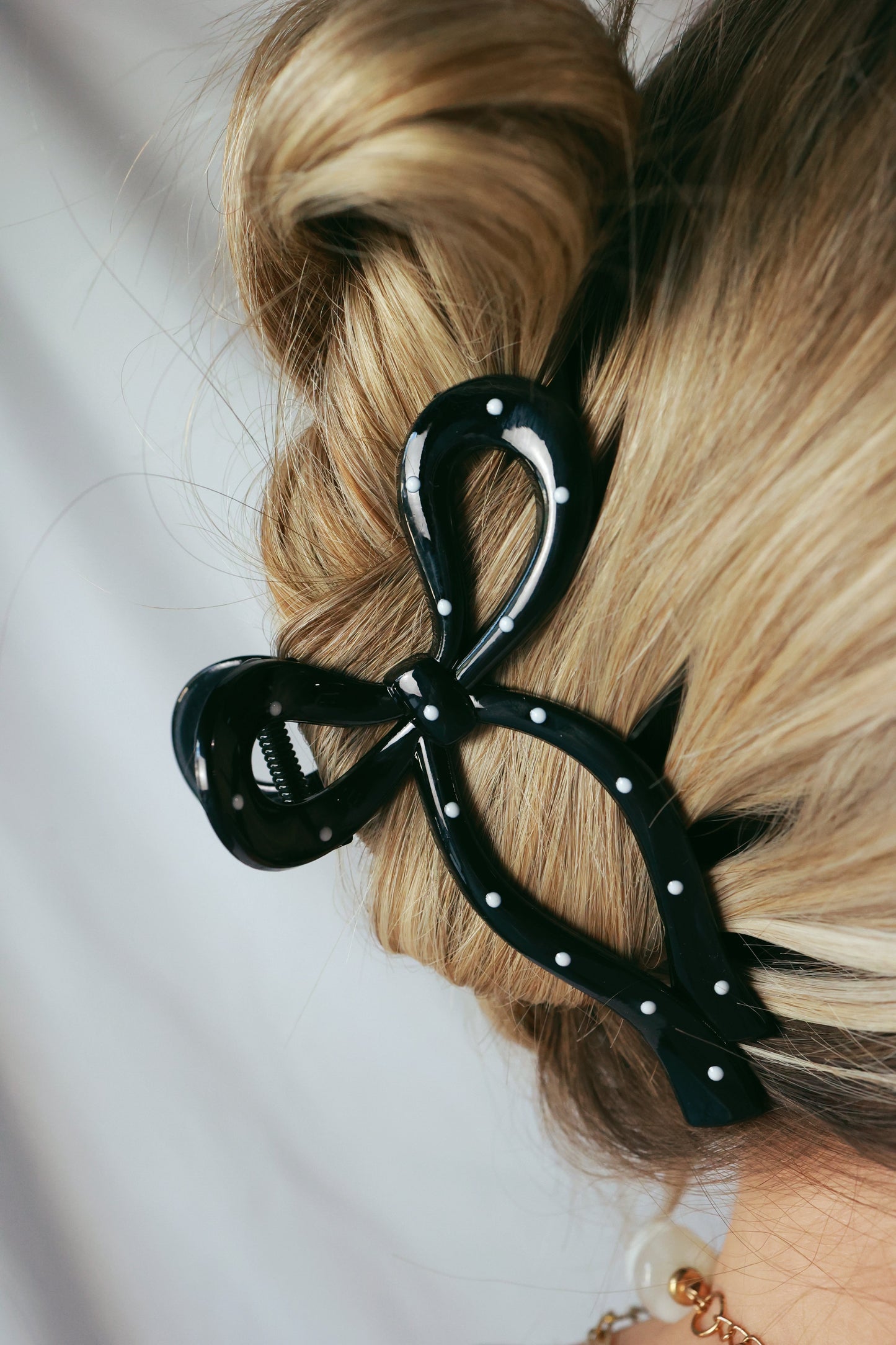 BLACK POLKA DOT BOW CLIP